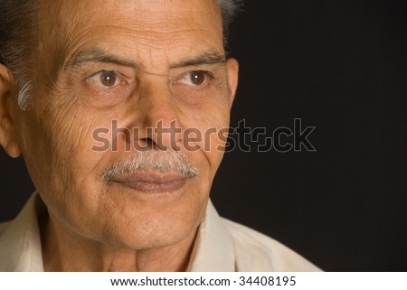 A portrait of a senior Indian man