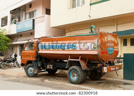 BANGALORE, INDIA - JULY 15: A water tanker supplies water to a home on July 15, 2011 in Bangalore. Many parts of urban India are experiencing acute water shortage as cities expand rapidly.
