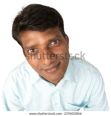 A worried Indian / South Asian business executive looking quizzically at the camera. Isolated on white background.