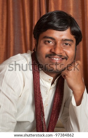 A young Indian man in traditional ethnic wear