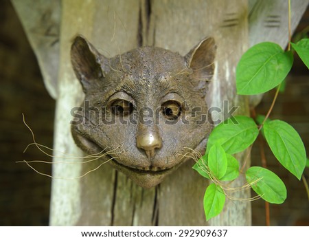 Bronze Model of the Face of A Smiling Cat at Rosemoor, Devon, England, UK