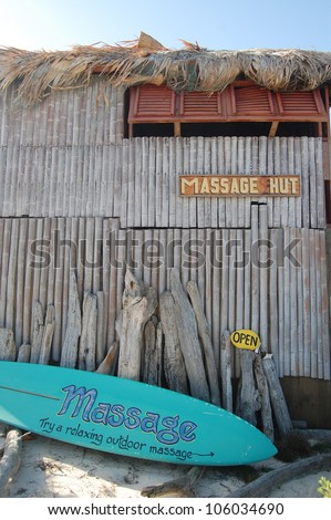 Massage hut with surfboard sign