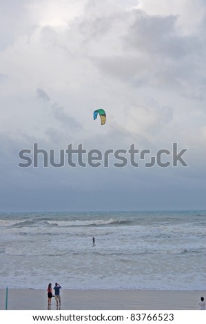 ORMOND BEACH, FL - AUGUST 25:  Spectators take photos of an unidentified kite-boarder as Hurricane Irene passes off the coast on August 25, 2011, in Ormond Beach, Florida.