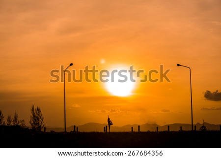Woman yoga in sunset or exercise silhouette (silhouette style)