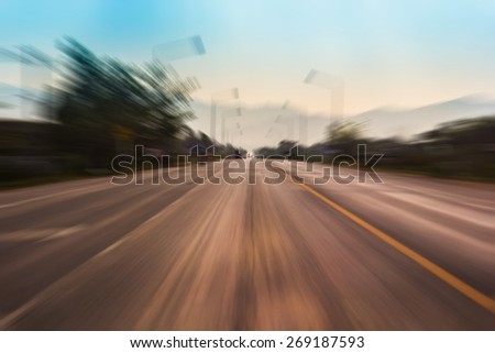 Motion blur of a rural road to infinity from inside a moving car
