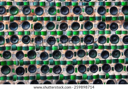 Colorful recycling background with texture of empty wine bottles in the wall
