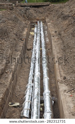 Breakthrough sewerage system.Pipes for water in an earthen trench. Repair and replacement of sewer.