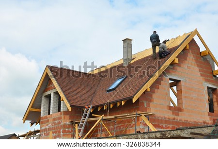 Roofing Construction and Building New Brick House with Modular Chimney, Skylights, Attic, Dormers and Eaves.