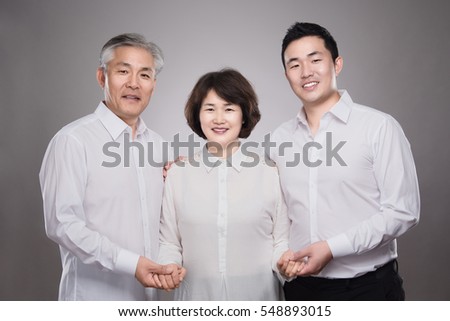 Asian happy family studio portrait - isolated