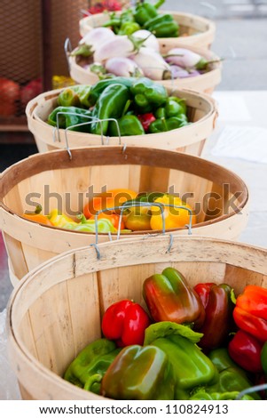 Baskets filled with fresh produce at a Farmer\'s market stand