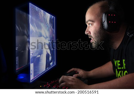 Gamer playing a first person shooter on high end pc.