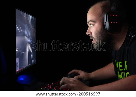 Gamer playing a first person shooter on high end pc.