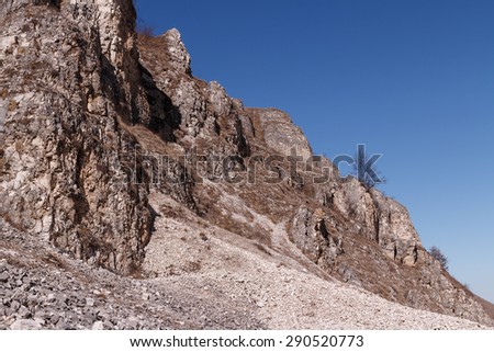 landscape. Mountain cliffs with fine gravel in the Caucasus mountains