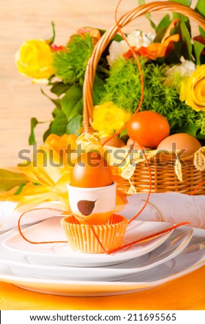 Easter table decoration in orange colours