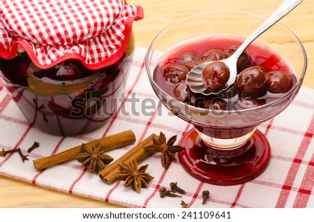 Appetizing cherry stewed fruit in the glass bowl