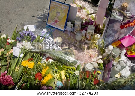 LOS ANGELES - JUNE 26: Flowers and candles lie on Farrah Fawcett\'s star on the Hollywood Walk of Fame on June 26, 2009 in Los Angeles. Fawcett, 62, died June 25 after battling cancer.