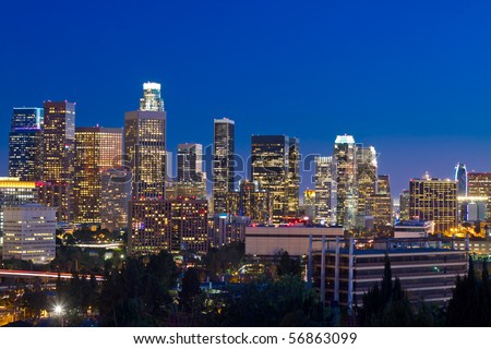 Los Angeles skyline at night with blue night sky.