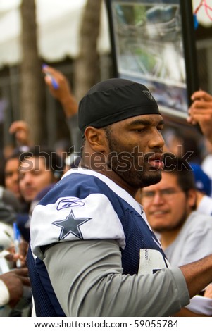 OXNARD, CA-AUGUST 14:  Victor Butler, # 57 of the Dallas Cowboys, stops to speak with fans and sign autographs following opening day practice of Training Camp August 14, 2010 in Oxnard, CA.