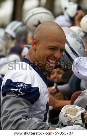 OXNARD, CA-AUG 14: Miles Austin, #19 and wide receiver of the Dallas Cowboys, signs autographs at opening day practice August 14, 2010 in Oxnard, CA. The team will be in camp here until Aug. 27, 2010.