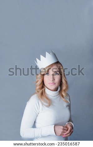 Beautifull woman in a paper crown. Queen. New Year celebration