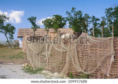 Fishing nets on the fence in the Cossack village, Ataman, Russia.