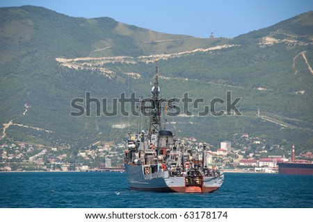 Ship against the wooded mountains