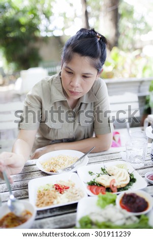 Young Asian woman eating lunch time
