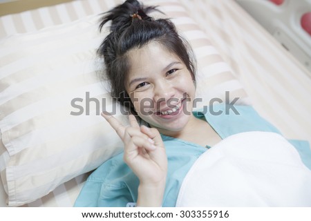 Asia Girl Happy On Hospital Bed