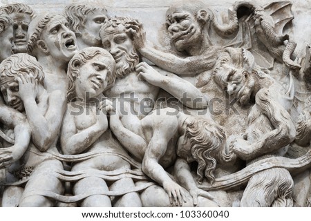 Bas-relief with the Last Judgement image on a facade of the Cathedral  Duomo in the city of Orvieto, Umbrija, Italy