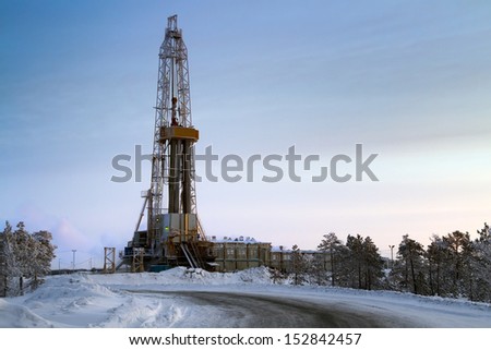 The drilling unit in the winter in twilight in Western Siberia, Russia