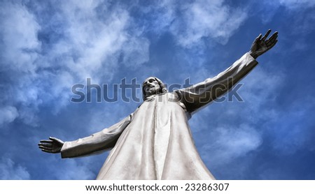 Statue of the Christ against the cloudy sky in clear weather