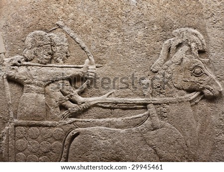 Bas-relief of ancient soldiers on a chariot - an exhibit from Museum of Anatolian Civilizations, Ankara, Turkey