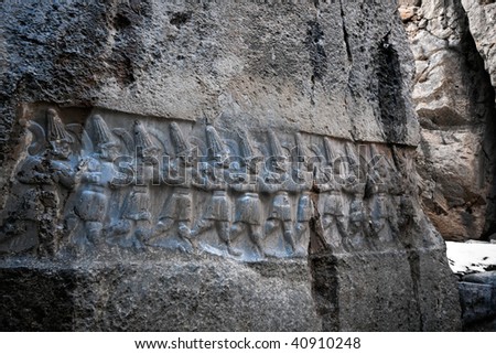 Bas-relief with the image  gods of an underground kingdom in ancient sanctuary Yazilikaya, Turkey