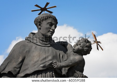 Statue Catholic saint Anthony of Padua with Baby Jesus on the Charles Bridge on the river Vltava, Prague,  Czech Republic