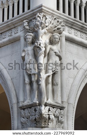 Column capital at Doge\'s Palace in Venice shows architectural details of a Adam and Eve (Fall of man)