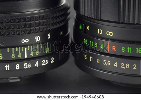 Two vintage camera lens with colorful digital scale - close-up