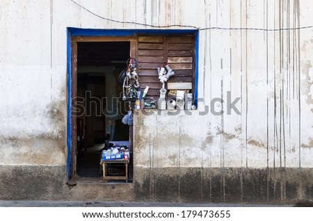 TRINIDAD, CUBA - DECEMBER 9, 2013: Communist industrial shop in Cuba , typical for Cuba\'s small industrial shop, view from outside