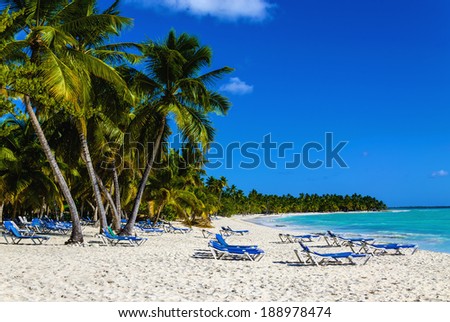 Beach chair on sandy Caribbean beach in Cuba Concept for rest relaxation holidays resort Beach chair on sandy Caribbean beach in Cuba Concept for rest relaxation holidays resort