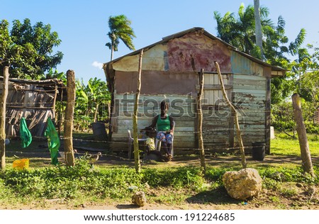 DOMINICAN REPUBLIC, PUNTA CANA - JANUARY 14, 2014: Traditional countryside house - poor woden cabins at the Dominican Republic, part of the Greater Antilles archipelago in the Carribean region
