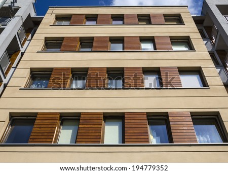 Architectural background of a modern apartment with wooden facade