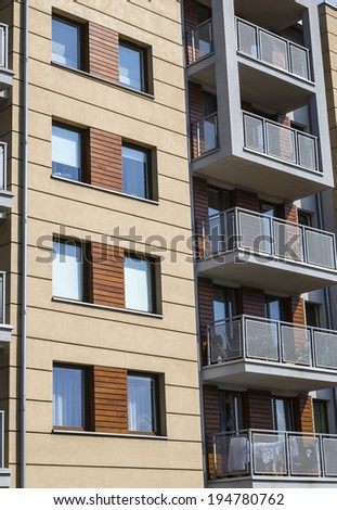 Architectural background of a modern apartment with wooden facade
