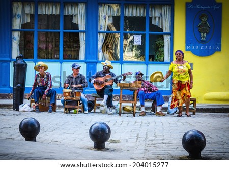 HAVANA, CUBA - DECEMBER 2, 2013: Street musicians on one of Havana\'s streets, the main part of the atmosphere of Old Havana