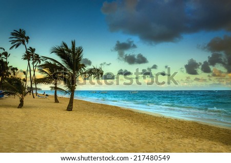 Romanctic view of sunrise on the exotic beach of Caribbean Sea.