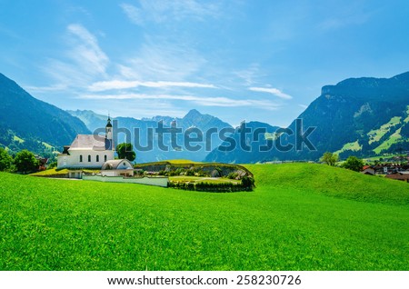 Beautiful alpine landscape with typical alpine church, Austrian Alps, Europe