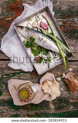 Raw fish ready to cook on a metallic tray