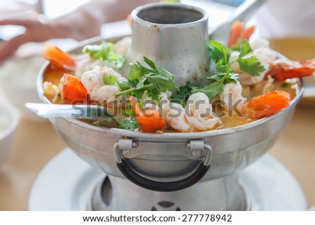 Tom Yum Goong, Thai hot and spicy soup with shrimp in a hot pot