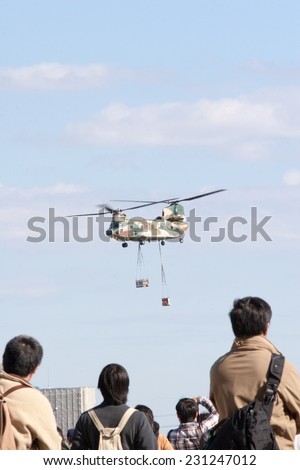 SAITAMA, JAPAN - NOVEMBER 3, 2014: Japanese Air Self-Defense Force holds their annual airshow at their Iruma airbase. They have a demonstration flight by a military cargo helicopter called CH-47.