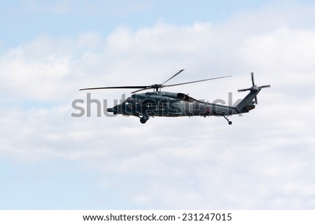 SAITAMA, JAPAN - NOVEMBER 3, 2014: Japanese Air Self-Defense Force holds their annual airshow at their Iruma airbase. They have a demonstration flight by a military rescue helicopter called UH-60J.