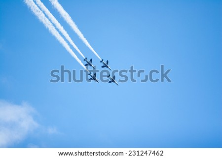 SAITAMA, JAPAN - NOVEMBER 3, 2014: Japanese Air Self-Defense Force holds their annual airshow at their Iruma airbase. They have a demonstration flight by an aerobatic team called Blue Impulse.