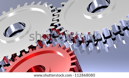 Two steel gears in connection with red one